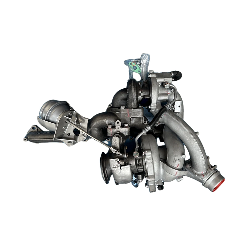 Automotive turbocharger assembly with turbine and compressor housings on a white background